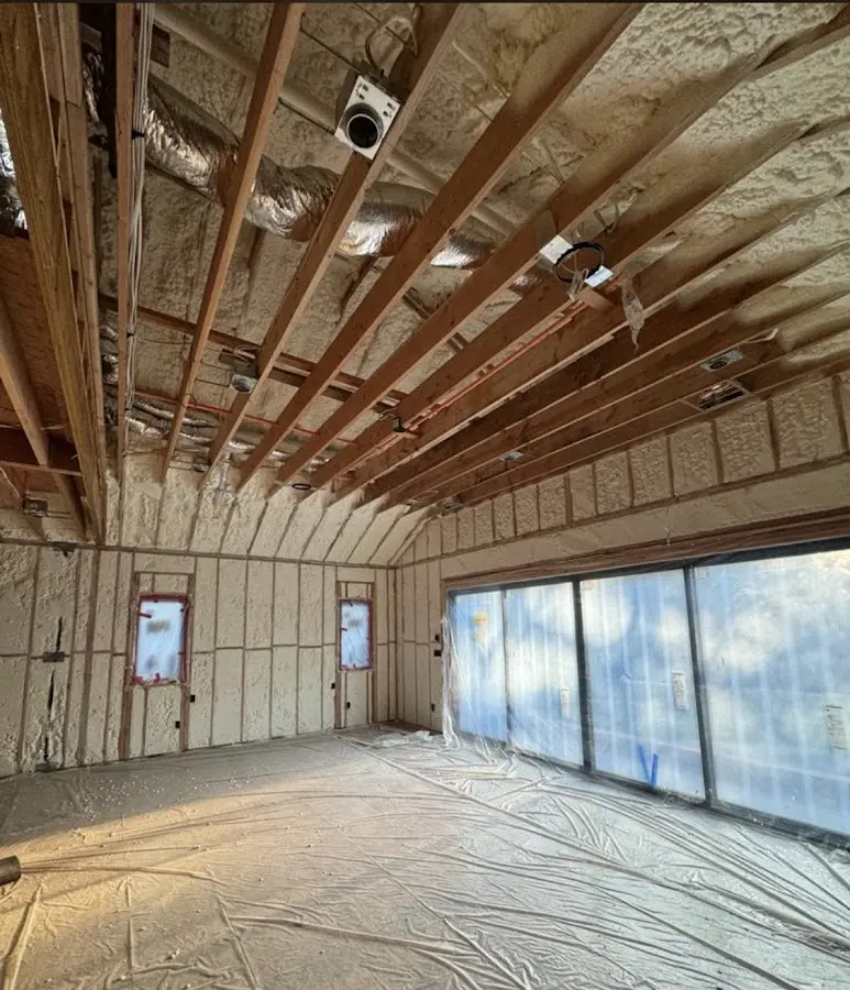 Interior walls and ceiling insulated with spray foam during new construction in Chili
